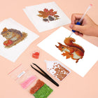 Working on several Autumn Woodland Friends mini diamond painting designs with drills and applicator