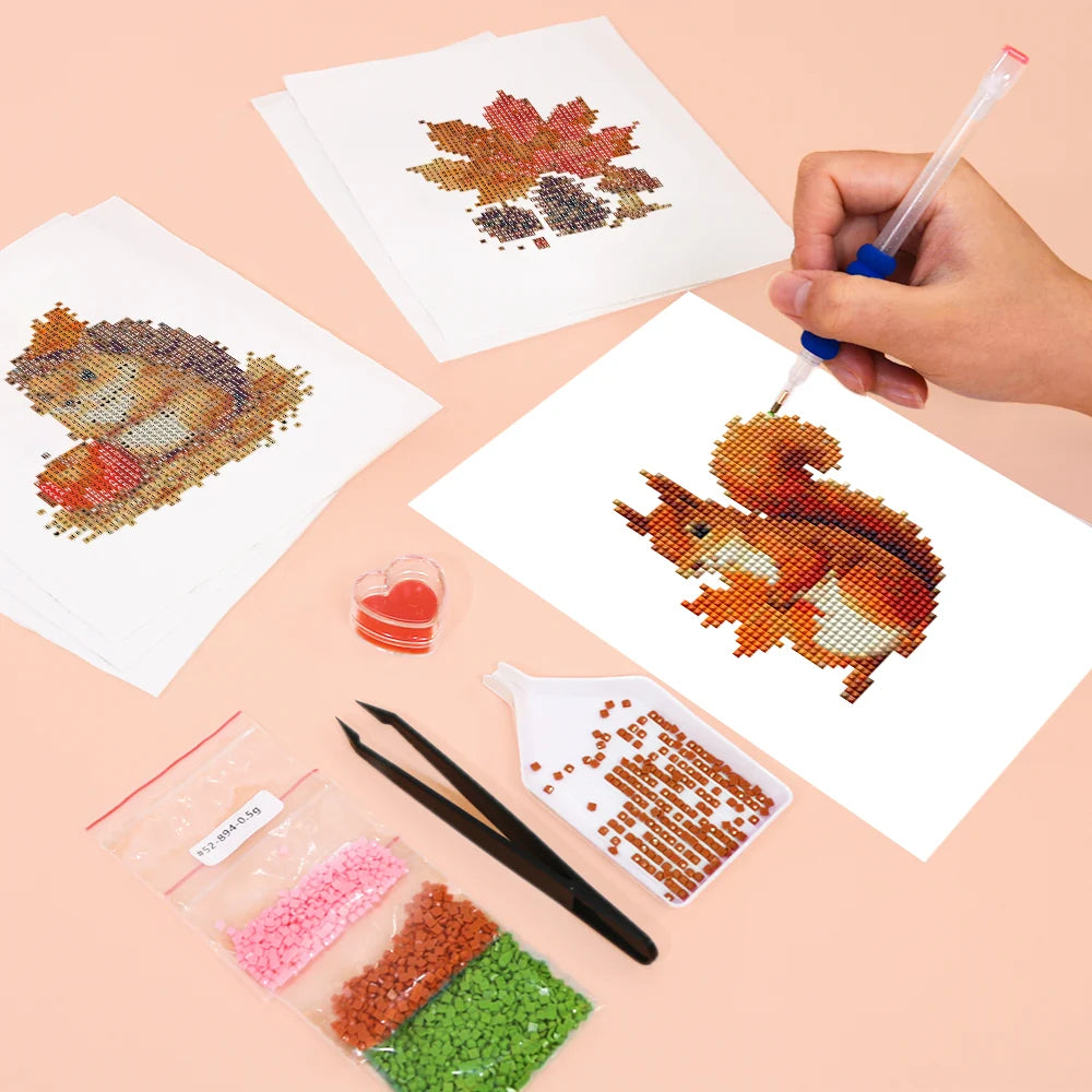 Working on several Autumn Woodland Friends mini diamond painting designs with drills and applicator