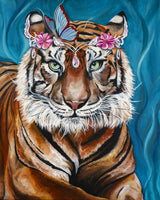 Tiger with green eyes and a butterfly-and-flower headpiece against a teal background