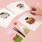 Working on several Christmas Black Cats mini diamond painting designs with drills and applicator