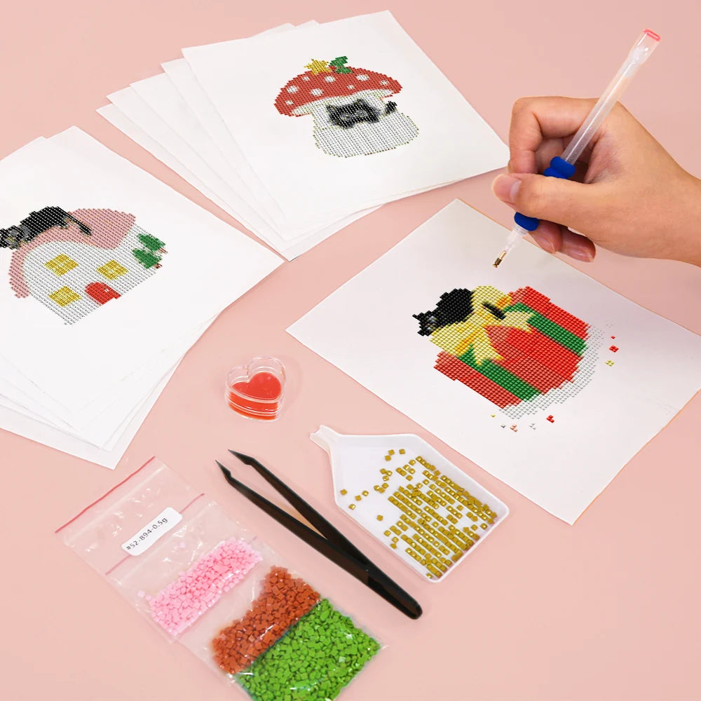 Working on several Christmas Black Cats mini diamond painting designs with drills and applicator