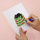 Applying drills to a Christmas Black Cats mini diamond painting design