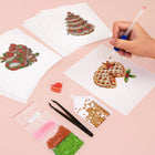 Working on several Christmas Treats & Sweets mini diamond painting designs with drills and applicator