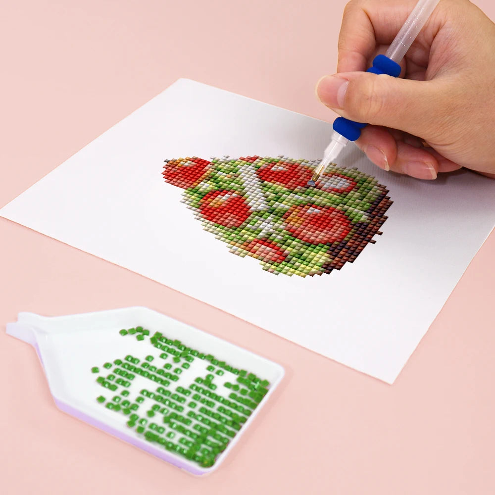 Close-up of drills being placed on a Christmas Treats & Sweets mini diamond painting design