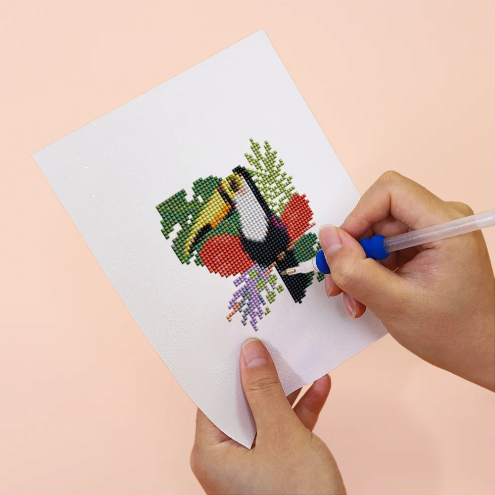 Applying drills to a Colourful Animal Friends mini diamond painting design
