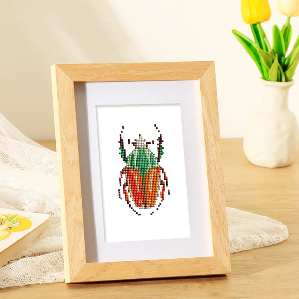 Framed Colourful Beetles mini diamond painting artwork presented as finished decor
