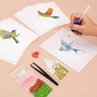 Working on several Colourful Birds mini diamond painting designs with drills and applicator