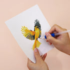 Applying drills to a Colourful Birds mini diamond painting design