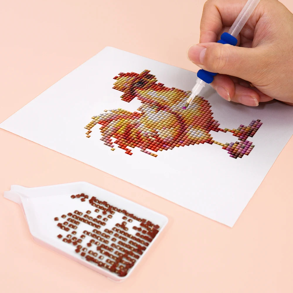 Close-up of drills being placed on a Colourful Roosters mini diamond painting design