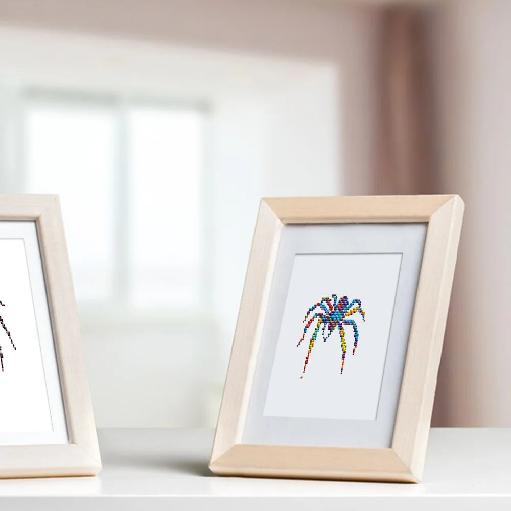 Framed Colourful Spiders mini diamond painting artwork displayed in a styled setting