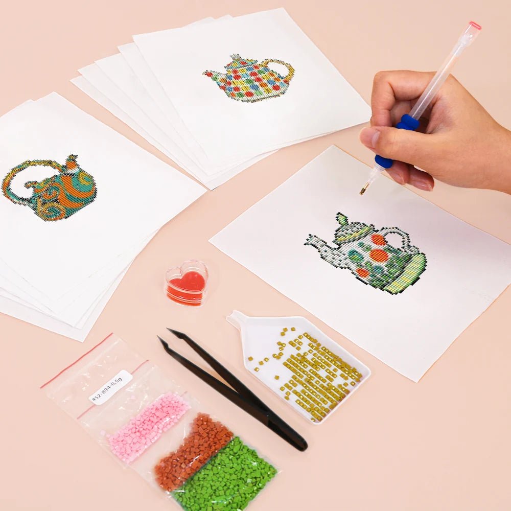 Working on several Colourful Teapots mini diamond painting designs with drills and applicator