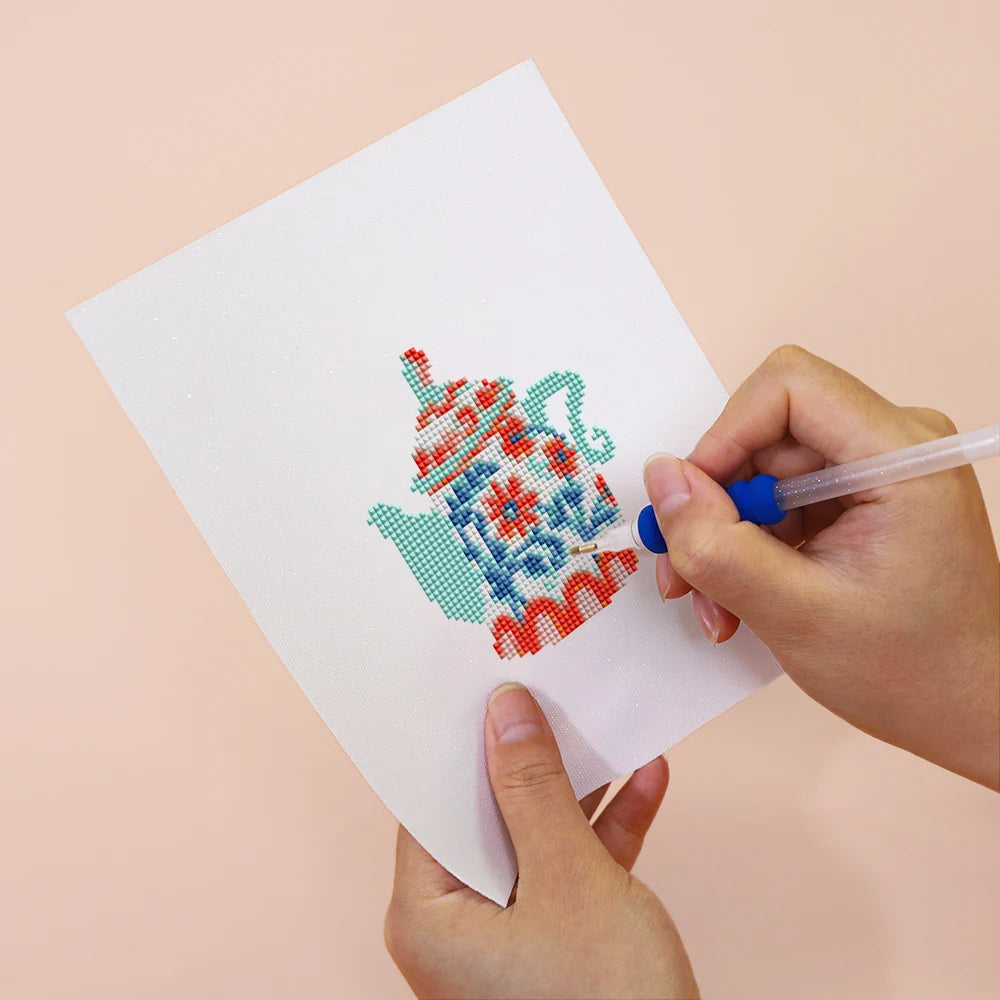 Applying drills to a Colourful Teapots mini diamond painting design