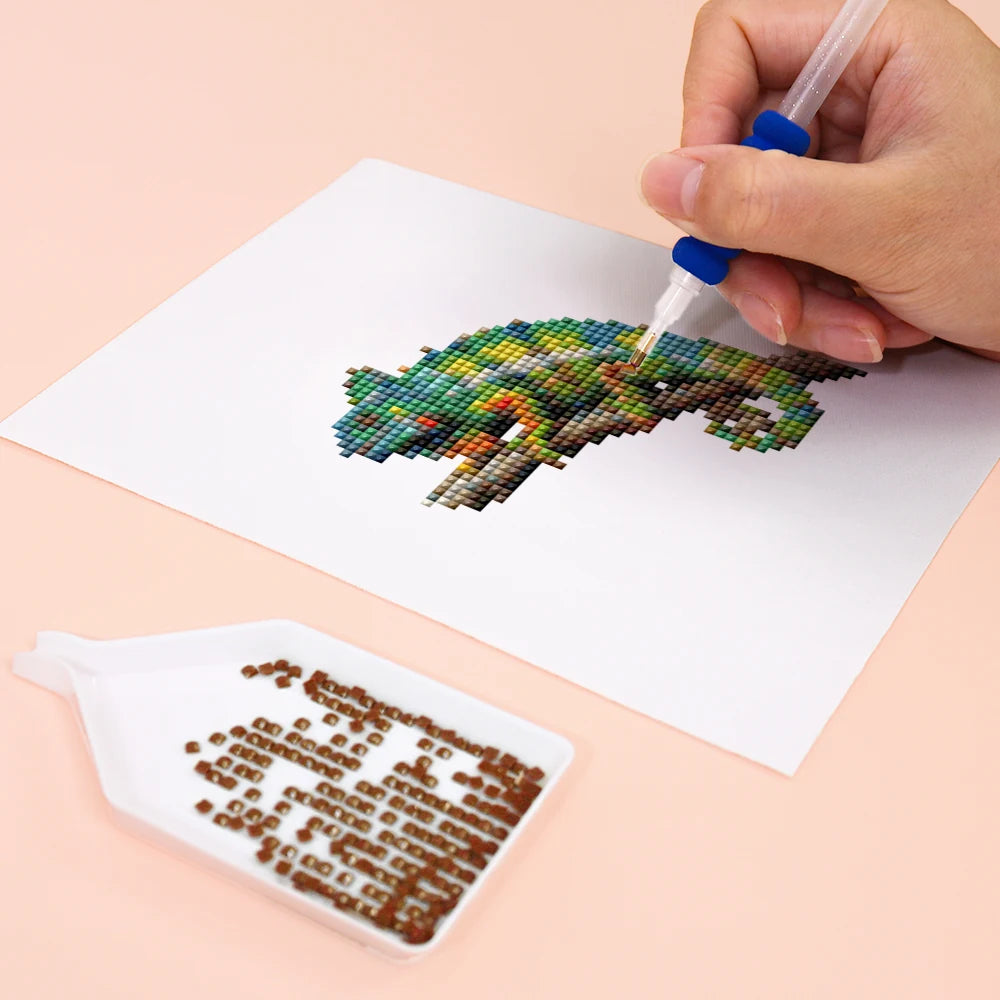 Close-up of drills being placed on a Colourful Woodland Wildlife mini diamond painting design