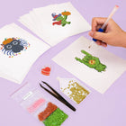 Working on several Cute Halloween Monsters mini diamond painting designs with drills and applicator