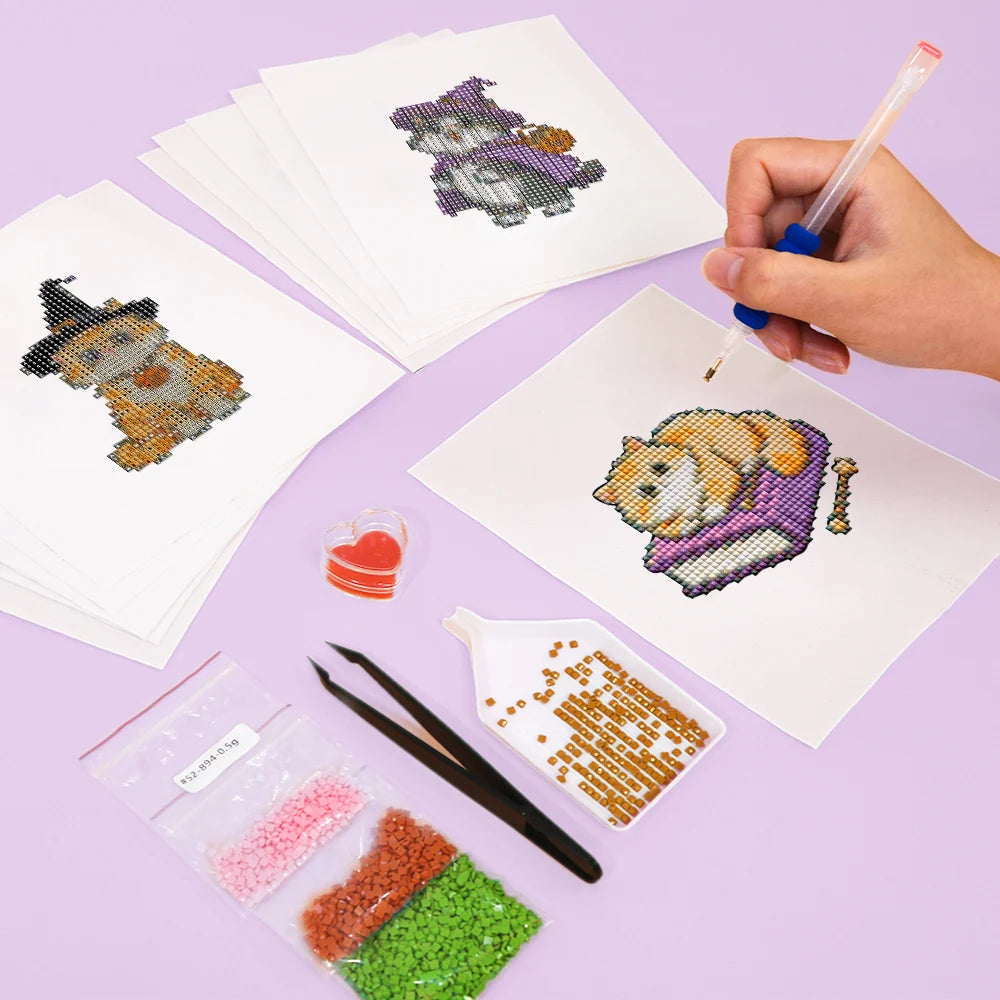 Working on several Cute Halloween Pets mini diamond painting designs with drills and applicator