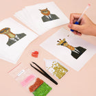 Working on several Dapper Animal Gentlemen mini diamond painting designs with drills and applicator