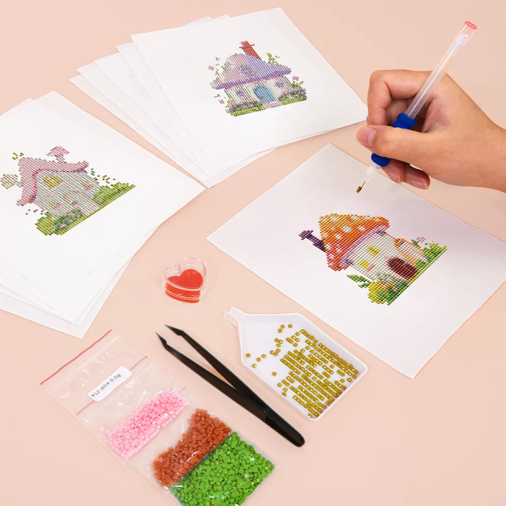 Working on several Fairy Garden Cottages mini diamond painting designs with drills and applicator