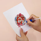 Applying drills to a Festive Ornaments & Gifts mini diamond painting design