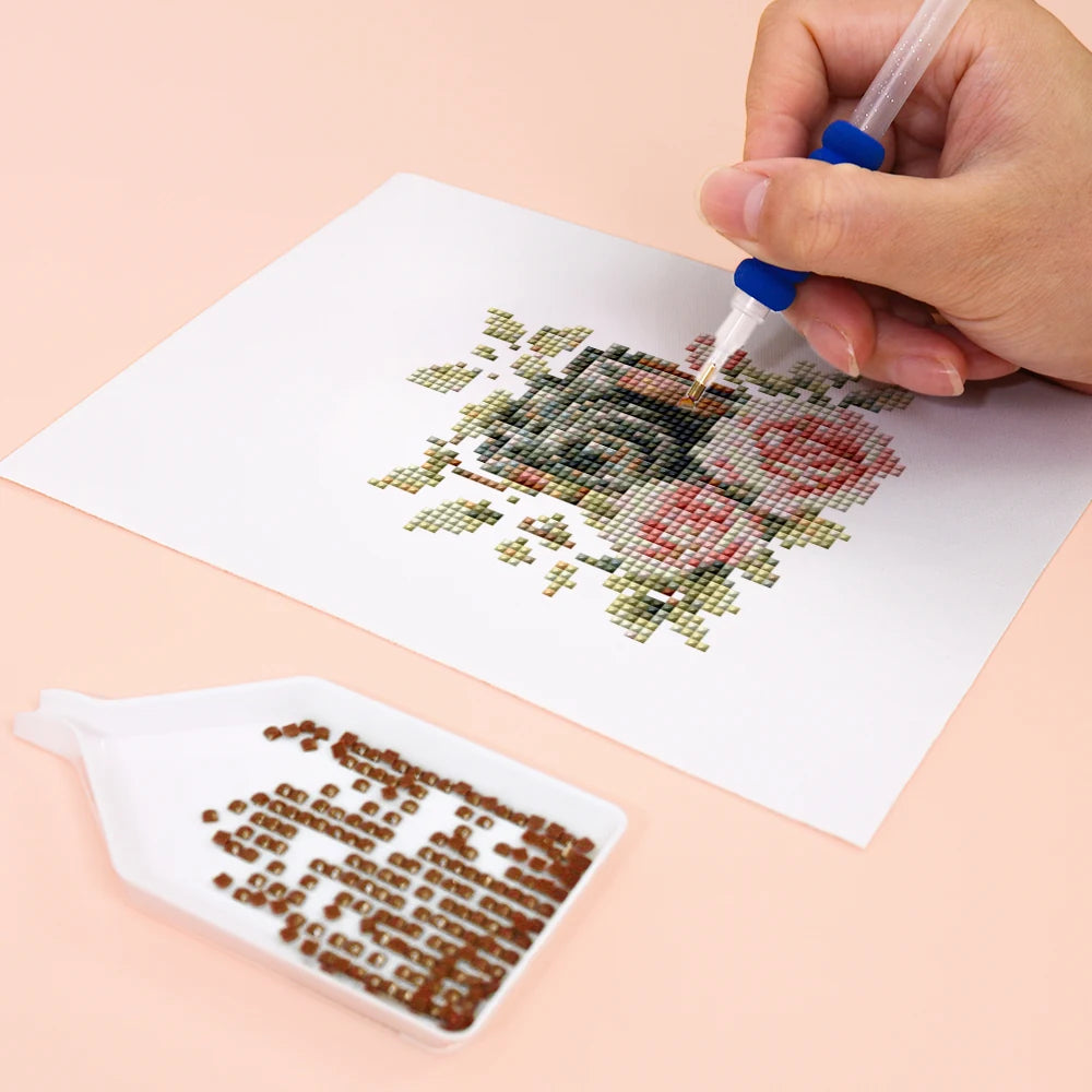 Close-up of drills being placed on a Floral Arrangements & Wreaths mini diamond painting design