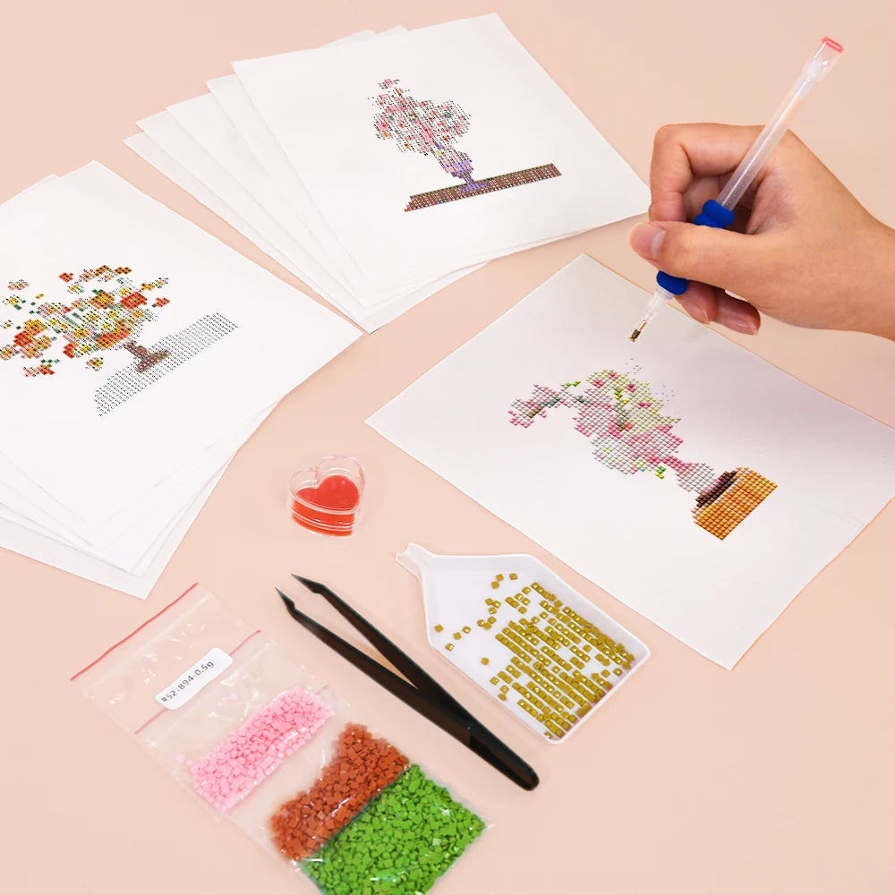 Working on several Floral Arrangements mini diamond painting designs with drills and applicator