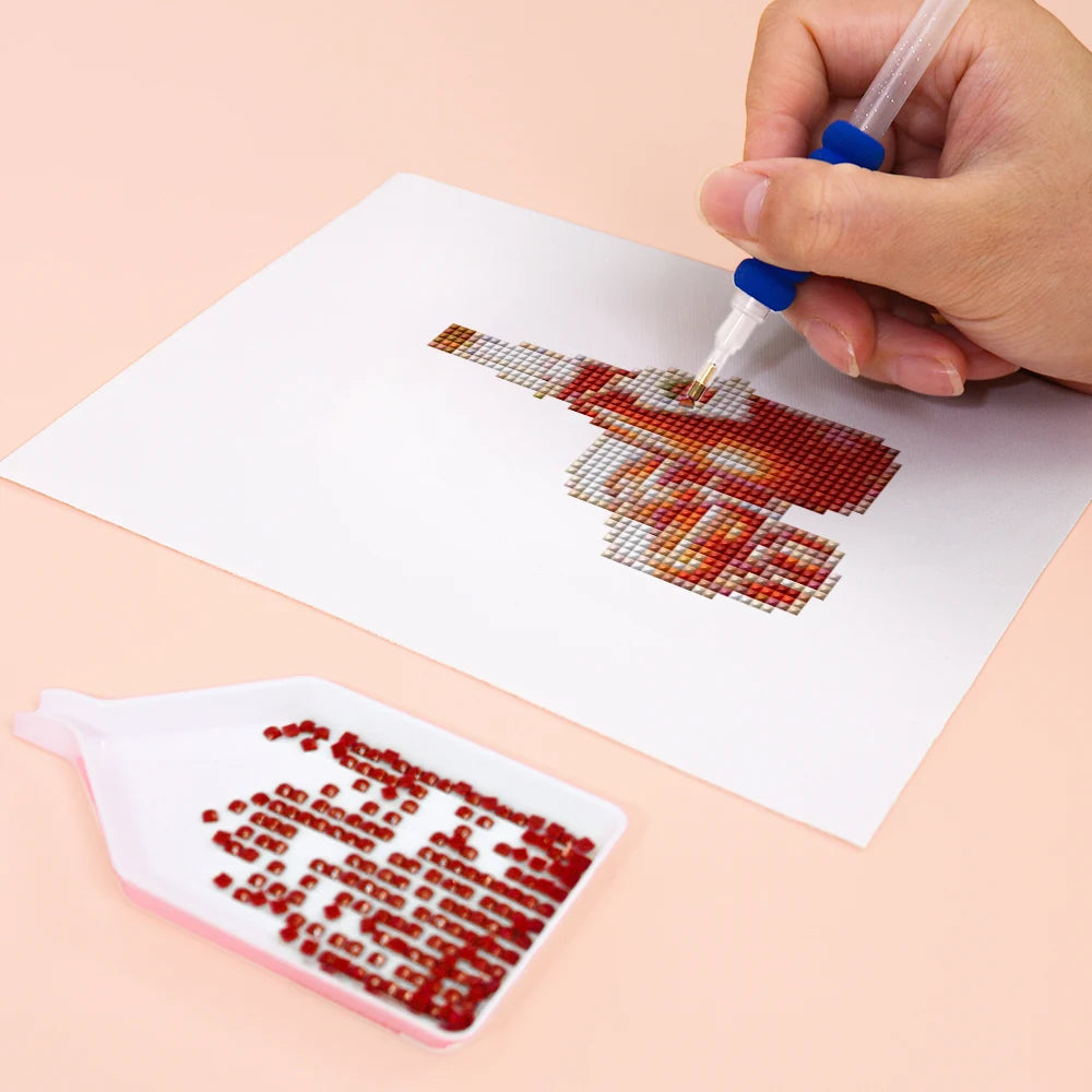 Close-up of drills being placed on a Garden Gifts & Florals mini diamond painting design