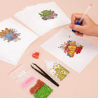 Working on several Garden Harvest & Wreaths mini diamond painting designs with drills and applicator
