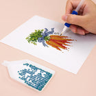 Close-up of drills being placed on a Garden Harvest & Wreaths mini diamond painting design