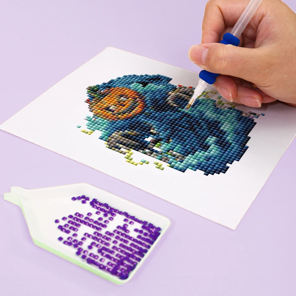 Close-up of drills being placed on a Gothic Halloween Night mini diamond painting design