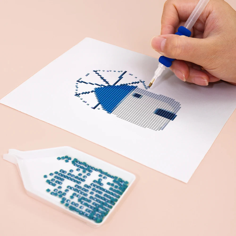 Close-up of drills being placed on a Greek Island Icons mini diamond painting design