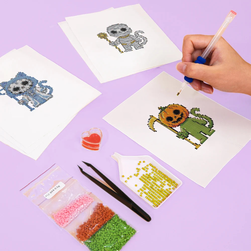 Working on several Halloween Monster Friends mini diamond painting designs with drills and applicator