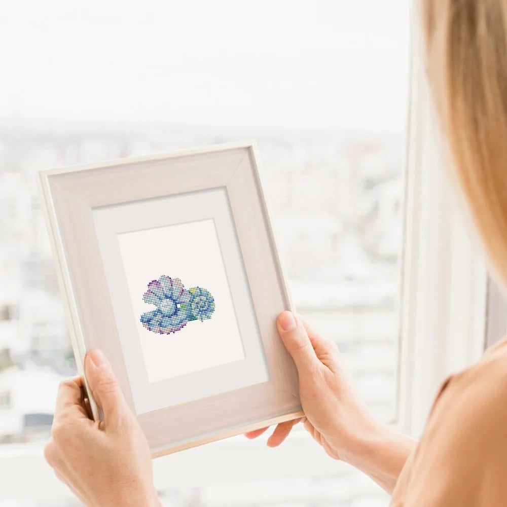 Framed Ocean Coral & Shells mini diamond painting artwork displayed in a styled setting