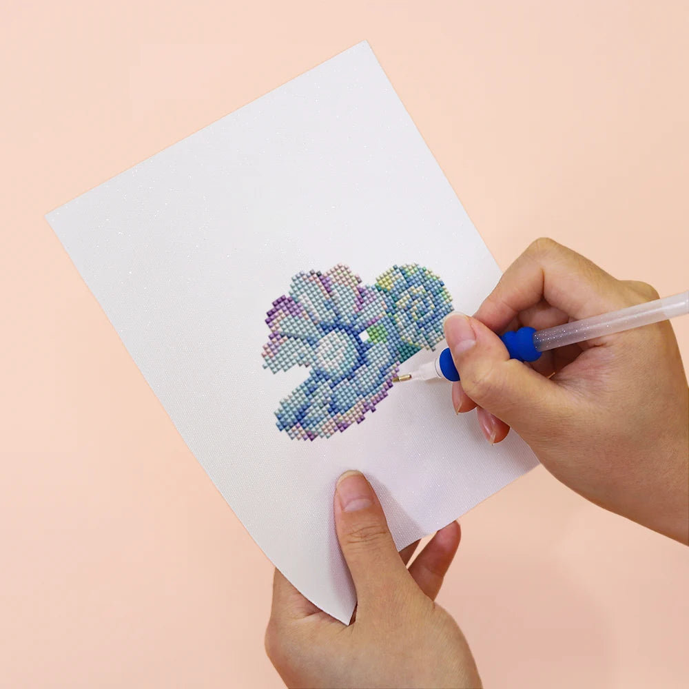 Applying drills to a Ocean Coral & Shells mini diamond painting design