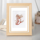 Framed Pastel Mermaids mini diamond painting artwork displayed in a styled setting