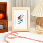 Completed Pastel Mermaids mini diamond painting shown as framed decor