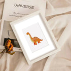 Completed Playful Dinosaurs mini diamond painting shown as framed decor