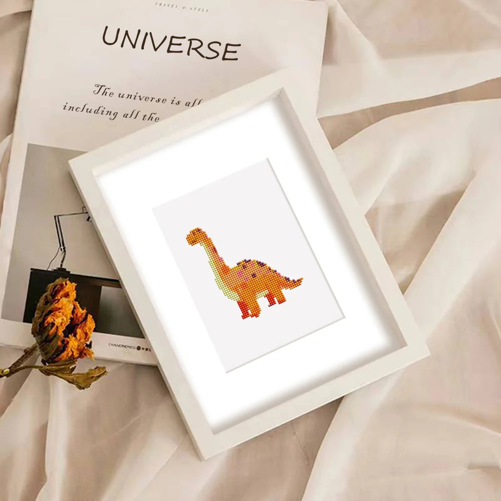 Completed Playful Dinosaurs mini diamond painting shown as framed decor