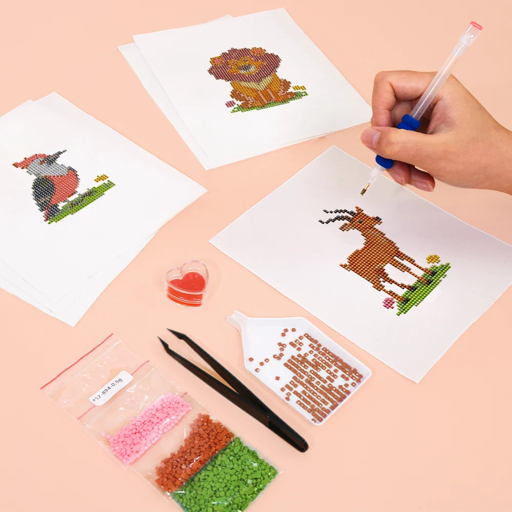 Working on several Safari Animal Friends mini diamond painting designs with drills and applicator