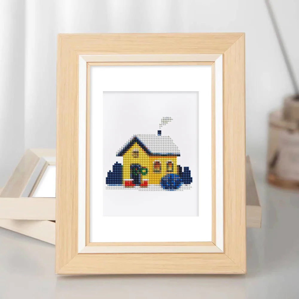 Framed Tiny Village Houses mini diamond painting artwork displayed in a styled setting