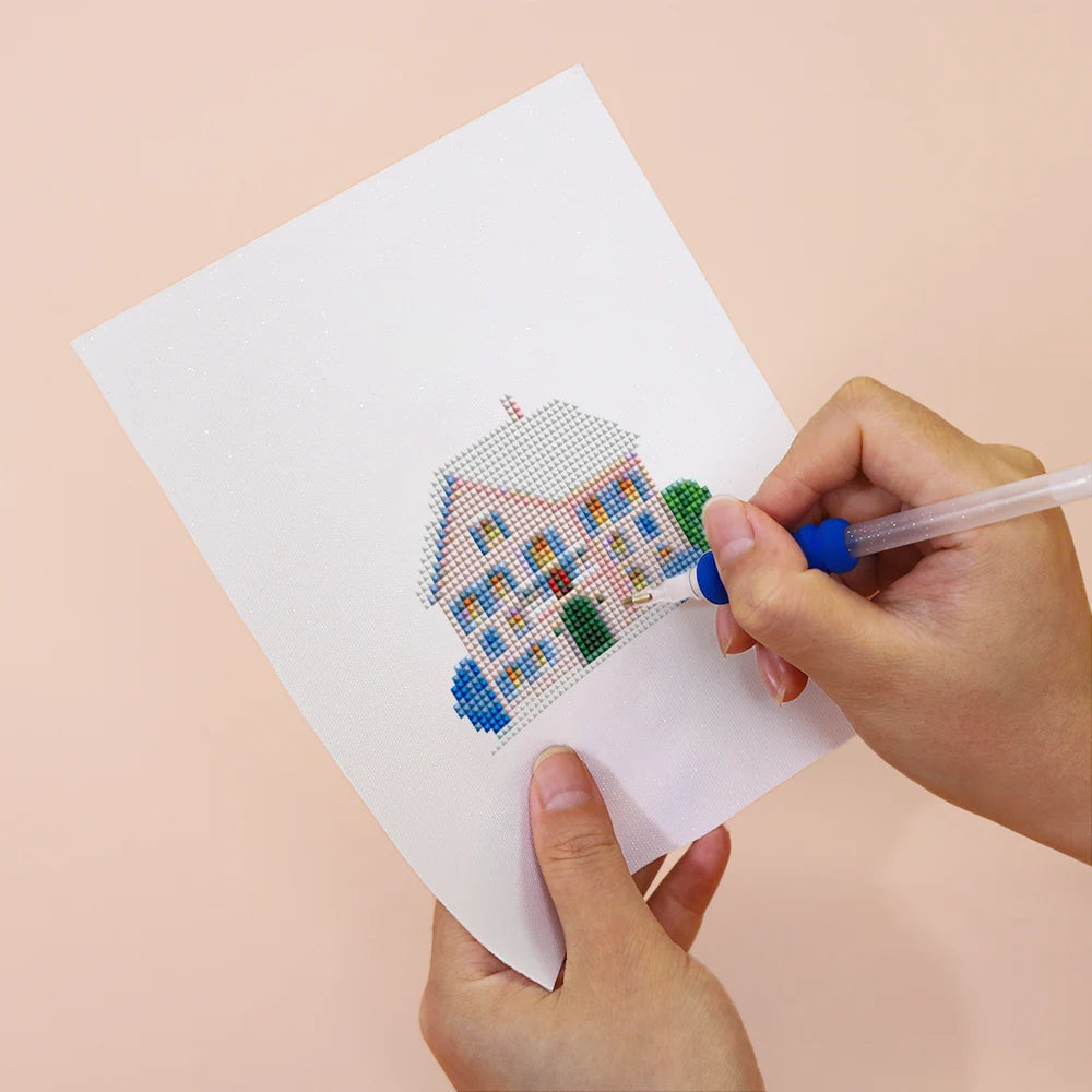 Applying drills to a Tiny Village Houses mini diamond painting design