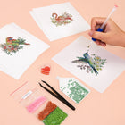 Working on several Tropical Birds & Blooms mini diamond painting designs with drills and applicator