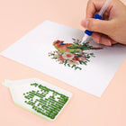 Close-up of drills being placed on a Tropical Birds & Blooms mini diamond painting design