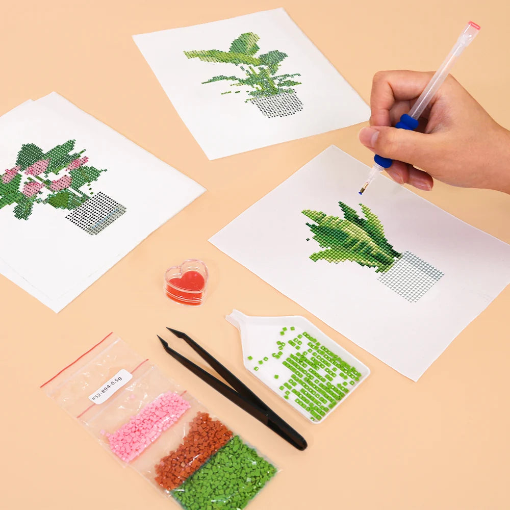 Working on several Tropical Houseplants mini diamond painting designs with drills and applicator
