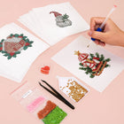 Working on several Vintage Christmas Village mini diamond painting designs with drills and applicator