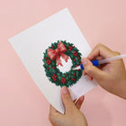 Applying drills to a Vintage Christmas Village mini diamond painting design
