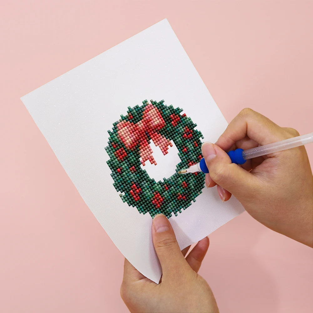 Applying drills to a Vintage Christmas Village mini diamond painting design