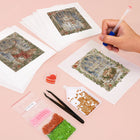 Working on several Vintage Christmas Windows mini diamond painting designs with drills and applicator
