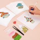 Working on several Whimsical Mushrooms mini diamond painting designs with drills and applicator