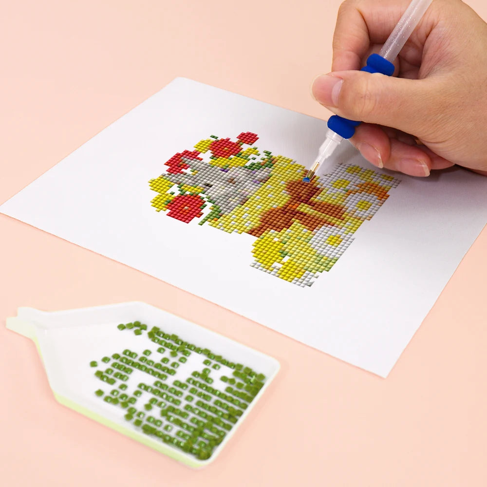 Close-up of drills being placed on a Whimsical Woodland Friends mini diamond painting design