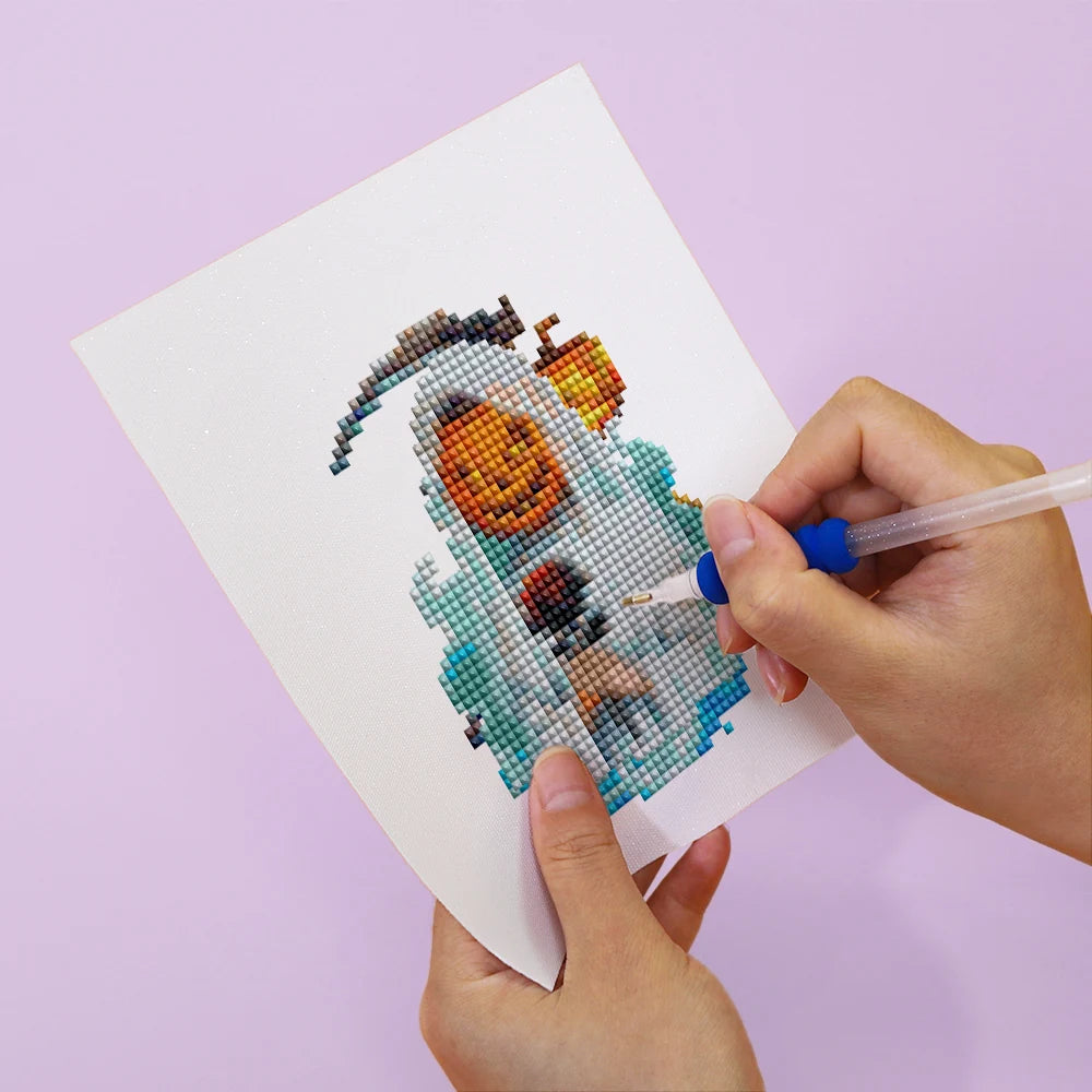 Applying drills to a Witchy Pumpkin Parade mini diamond painting design
