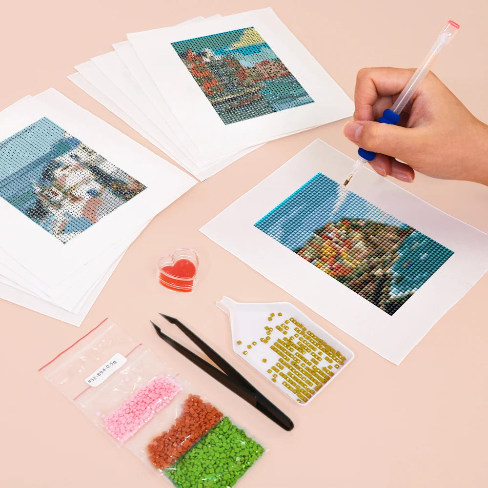 Working on several World Landmarks mini diamond painting designs with drills and applicator